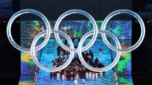 Flag bearers Brittany Bowe and John Shuster of Team USA carry their flag during the Opening Ceremony of the Beijing 2022 Winter Olympics at the Beijing National Stadium on Feb. 4, 2022 in Beijing, China.