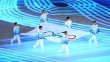 Zhihuan Luo, Hui Zhang, Jiajun Li, Xue Shen, Xiaopeng Han and Hong Zhang carry the Olympic Flag during the Opening Ceremony of the Beijing 2022 Winter Olympics at the Beijing National Stadium on Feb. 4, 2022 in Beijing, China.