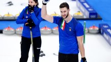 Amos Mosaner and Stefania Constantini of Team Italy celebrate winning the gold medal against Team Norway