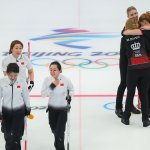 Yu Han, Tui Wang, Ziqi Dong, KLijun Zhang of Team China leaves as Madeleine Dupont, My Larsen, Mathilde Halse and Denis Dupont of Team Denmark celebrate after winning their Women's Round Robin Session at the National Aquatics Centre on Feb. 10, 2022, in Beijing.