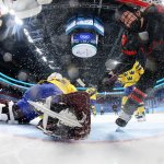 Defender Erin Ambrose #23 of Team Canada collides with goalkeeper Emma Soderberg #30 of Team Sweden in the second period during the Women's Ice Hockey Quarterfinal match at the 2022 Winter Olympic Games at Wukesong Sports Centre, Feb. 11, 2022 in Beijing.