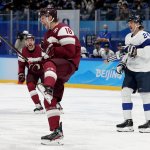 Rodrigo Abols #18 of Team Latvia reacts after a goal in the third period during the Men's Ice Hockey Preliminary Round Group C match against Team Finland at the 2022 Winter Olympic Games at National Indoor Stadium, Feb. 11, 2022, in Beijing.