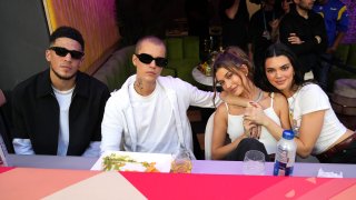 INGLEWOOD, CALIFORNIA - FEBRUARY 13: Justin Bieber, Hailey Bieber and Kendall Jenner attend Super Bowl LVI at SoFi Stadium on February 13, 2022 in Inglewood, California.