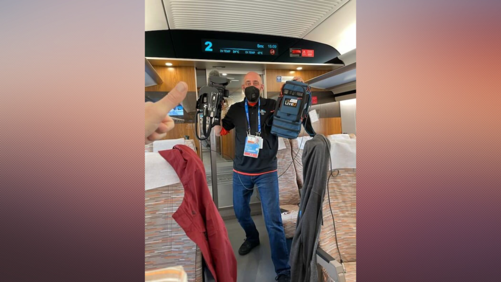 NBC 7 employee Jason Guinter prepares for a live shot from a high-speed train during the Winter Olympics in Beijing, Feb. 1, 2022.