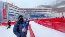 NBC 7 Anchor Steven Luke stands at the bottom of a ski run in the mountains outside of Beijing at the Winter Olympics, Feb. 13, 2022.