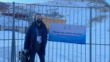 NBC 7 anchor Steven Luke poses for a photo within the "closed loop system" at the Winter Olympics in Beijing, Feb. 1, 2022.