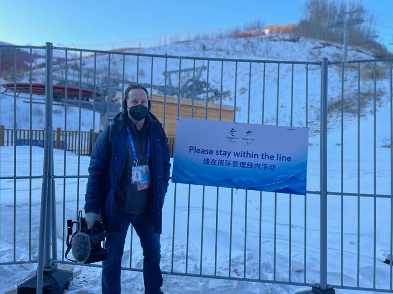 NBC 7 anchor Steven Luke poses for a photo within the "closed loop system" at the Winter Olympics in Beijing, Feb. 1, 2022.