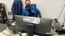 NBC 7 anchor Steven Luke sits at his desk in Beijing during the Winter Olympics, Jan. 31, 2022.