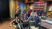 NBC 7 Anchor Steven Luke (right) poses for a photo with colleagues inside a TV studio at the Winter Olympics in Beijing, Feb. 20, 2022.