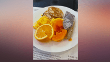 An array of breakfast items such as eggs, dragon fruit and oranges are displayed on a breakfast plate, Feb. 8, 2022.