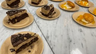 Two different kinds of dessert are displayed at a buffet-style dining hall in Beijing, Feb. 8, 2022.