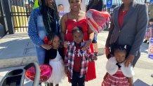 A family awaits the arrival of their loved one as USS Carl Vinson returns to San Diego on Monday, Feb. 14, 2022.