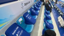 Empty chairs are seen in between a handful of spectators at the Curling Arena at the National Aquatics Center at the Winter Olympics in Beijing, Feb. 2, 2022.