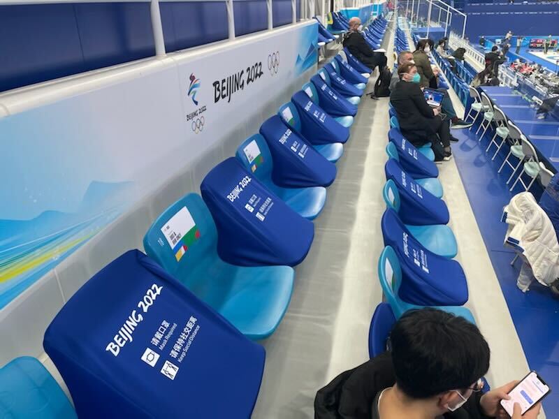 Empty chairs are seen in between a handful of spectators at the Curling Arena at the National Aquatics Center at the Winter Olympics in Beijing, Feb. 2, 2022.