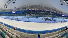 People move about on the speed skating ice rink at the Winter Olympics in Beijing, Feb. 15, 2022.