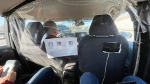 NBC 7 anchor Steven Luke sits in a car ride to a venue at the Winter Olympics in Beijing, Feb. 1, 2022.