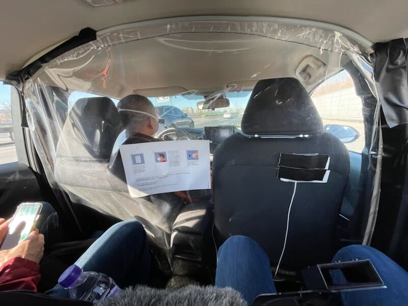 NBC 7 anchor Steven Luke sits in a car ride to a venue at the Winter Olympics in Beijing, Feb. 1, 2022.
