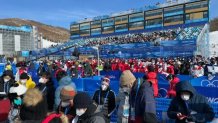 A crowd gathers at the halfpipe event at the Winter Olympics in Beijing, Feb. 10, 2022.