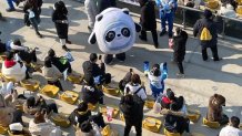 2022 Winter Olympic mascot Bing Dwen Dwen entertains the crowd inside the Big Air Shougang venue in Beijing, Feb. 9, 2022.