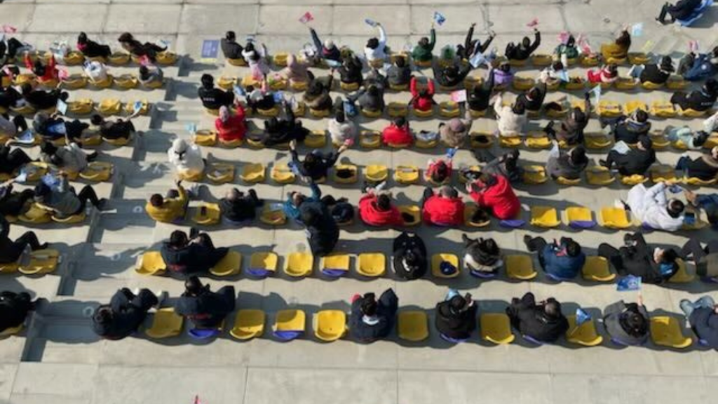 Spectators wave flags inside the Big Air Shougang Winter Olympic venue in Beijing, Feb. 9, 2022.