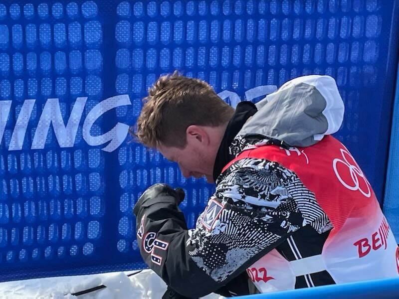 Snowboard legend Shaun White is overcome with emotion after his final halfpipe run at the Winter Olympics in Beijing, Feb. 10, 2022.