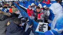 Snowboard legend Shaun White talks with the media after his final halfpipe run at the Winter Olympics in Beijing, Feb. 10, 2022.