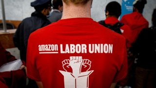 Amazon workers arrive with paperwork to unionize at the NLRB office in Brooklyn, New York, October 25, 2021.