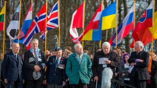 File - In this photo provided by the Buchenwald and Mittelbau-Dora Foundation, former Buchenwald prisoner Boris Romanchenko, second from right, from Ukraine attends with other survivors a commemoration for murdered prisoners at the former Buchenwald concentration camp near Weimar, Germany, April, 12, 2015.