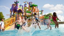 Children enjoy themselves at Sesame Place's Splash Castle in San Diego.