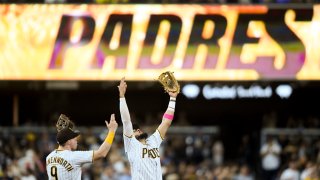 SAN DIEGO, CA – JULY 9: Jake Cronenworth #9 and Fernando Tatis Jr. #23 of the San Diego Padres celebrate after beating the Colorado Rockies 4-2 in a baseball game at Petco Park on July 9, 2021 in San Diego, California. (Photo by Denis Poroy/Getty Images)