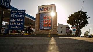 A sign shows gas prices.