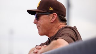 San Diego Padres manager Bob Melvin watches from the dugout during the MLB Spring Training baseball game between the Chicago Cubs and the San Diego Padres on March 26, 2022 at Peoria Stadium in Peoria, AZ.