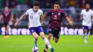 Giovanni Reyna of United States fights for the ball with Carlos Rodríguez of Mexico during a match between Mexico and United States as part of Concacaf 2022 FIFA World Cup Qualifiers at Azteca Stadium on March 24, 2022 in Mexico City, Mexico.