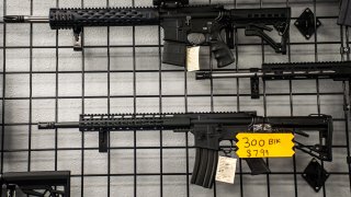 Assault Rifles on the wall for sale in America