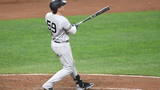 BALTIMORE, MD β SEPTEMBER 14: Luke Voit #59 of the New York Yankees hits a solo home run in the third inning during a baseball game against the Baltimore Orioles at Oriole Park at Camden Yards on September 14, 2021 in Baltimore, Maryland. (Photo by Mitchell Layton/Getty Images)