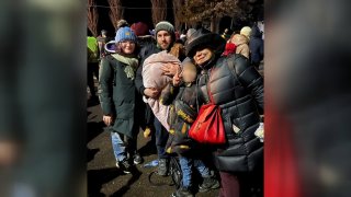 A picture of Ivette Rossano her husband, Mykhailo Naumov and their stepson as they try to flee Ukraine.