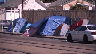 Several tents are set up by unsheltered San Diegans.