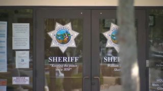 The San Diego County Sheriff's Department logo on the doors of a department office.