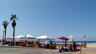 Street vendors along a San Diego beach.