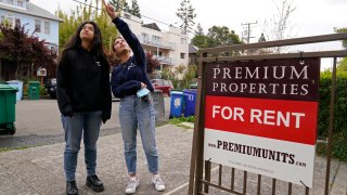 University of California, Berkeley freshmen Sanaa Sodhi, right, and Cheryl Tugade look for apartments in Berkeley, Calif., Tuesday, March 29, 2022. Millions of college students in the U.S. are trying to find an affordable place to live as rents surge nationally, affecting seniors, young families and students alike.