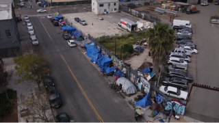 A drone flies over a homeless encampment in the East Village in downtown San Diego in this undated image.