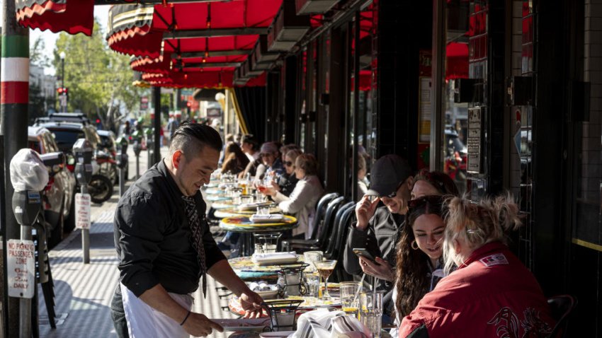 Tourists at the Stinking Rose restaurant in the North Beach district of San Francisco, California, U.S., on Tuesday, April, 12, 2022. San Francisco’s beleaguered tourism industry got good news when hotels hit their highest occupancy rate – 76% – since before the pandemic, last month, reported the San Francisco Chronicle. Photographer: David Paul Morris/Bloomberg via Getty Images