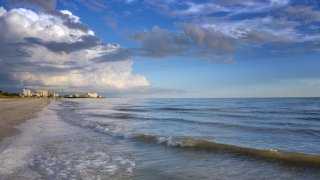 Blue Waves and Blue Sky lead down Estero Island at Fort Myers Beach, Florida.