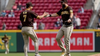 CINCINNATI, OHIO – APRIL 28: Ha-Seong Kim #7 and Eric Hosmer #30 of the San Diego Padres celebrate after beating the Cincinnati Reds 7-5 at Great American Ball Park on April 28, 2022 in Cincinnati, Ohio. (Photo by Dylan Buell/Getty Images)