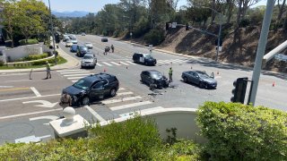 Three damaged cars in the intersection of Encinitas Boulevard and Via Cantebria in Encinitas following a car crash on Sunday, April 24, 2022.