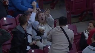 A fan made an incredible catch while holding a baby at the San Diego Padres vs. Cincinnati Reds game in Ohio on April 26, 2022.