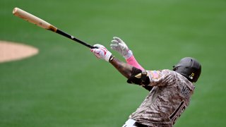 SAN DIEGO, CA – MAY 8:  Manny Machado #13 of the San Diego Padres hits a single during the fifth inning against the Miami Marlins on May 8, 2022 at Petco Park in San Diego, California. Major League Baseball players and coaches are wearing pink today in honor of Mother’s Day.  (Photo by Denis Poroy/Getty Images)