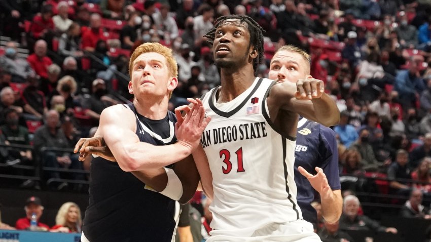 SAN DIEGO, CALIFORNIA – DECEMBER 22:  Jake Killingsworth #14 fo UC San Diego Tritons and Nathan Mensah #31 of the San Diego State Aztecs fight for position during a college basketball game at the Viejas Arena on December 22, 2021 in San Diego, California.  (Photo by Mitchell Layton/Getty Images)