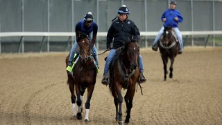 Epicenter , with trainer Steve Asmussen following on his horse during the morning training for the Kentucky Derby at Churchill Downs on May 04, 2022 in Louisville, Kentucky.