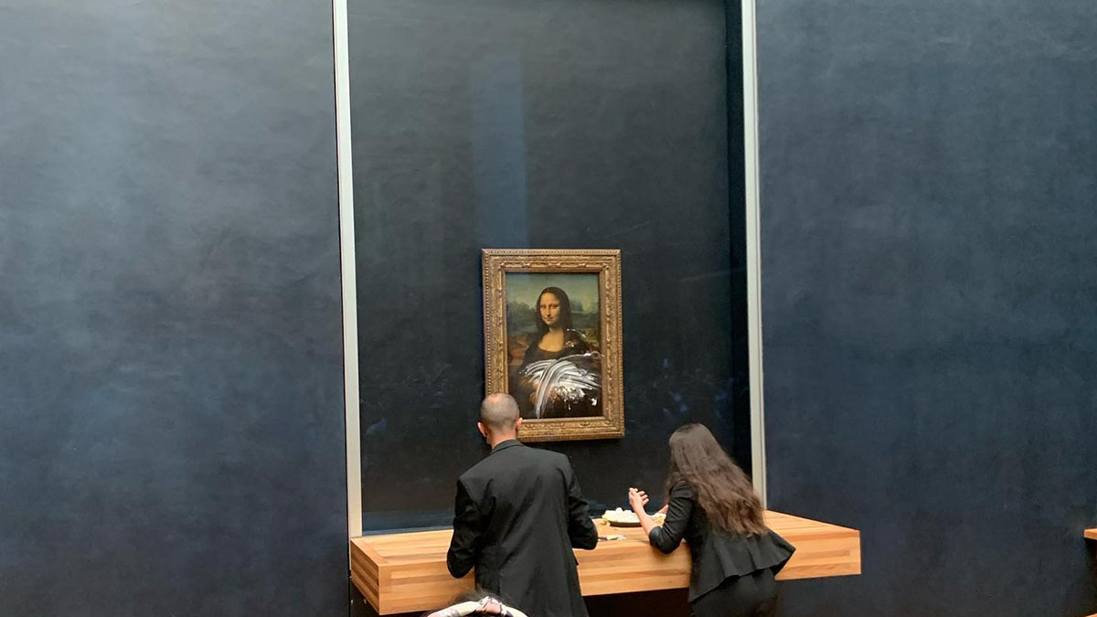 Man in Wig Throws Cake at Glass Protecting Mona Lisa NBC 7 San Diego